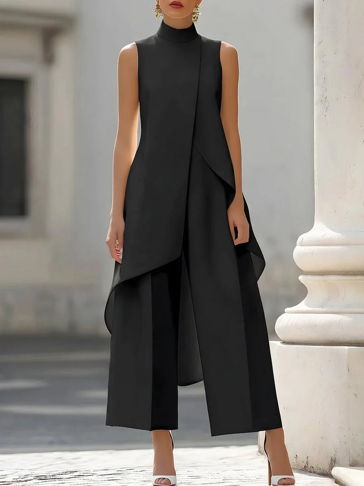 Full-length view of wide-leg trousers paired with sleeveless asymmetric top