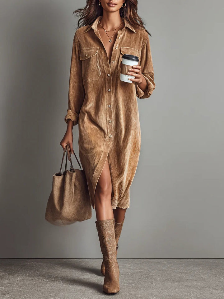 Woman wearing caramel button-up midi dress in ribbed corduroy with chest pockets and relaxed fit