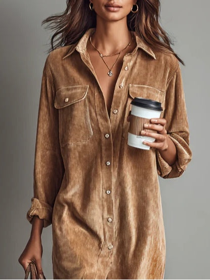 Close-up view of button-up midi dress showing pointed collar and full button closure detail