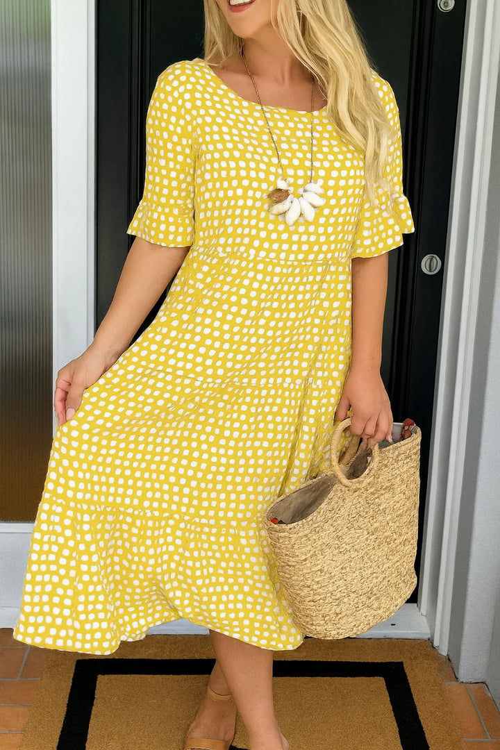 Woman styling short sleeve midi dress summer with sandals and woven tote for casual wear