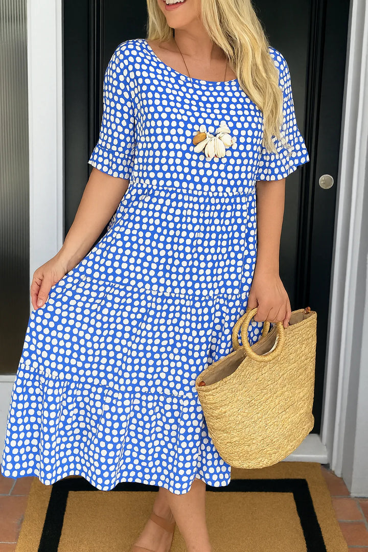 Close-up of gathered waist and tiered skirt detail on short sleeve midi dress summer