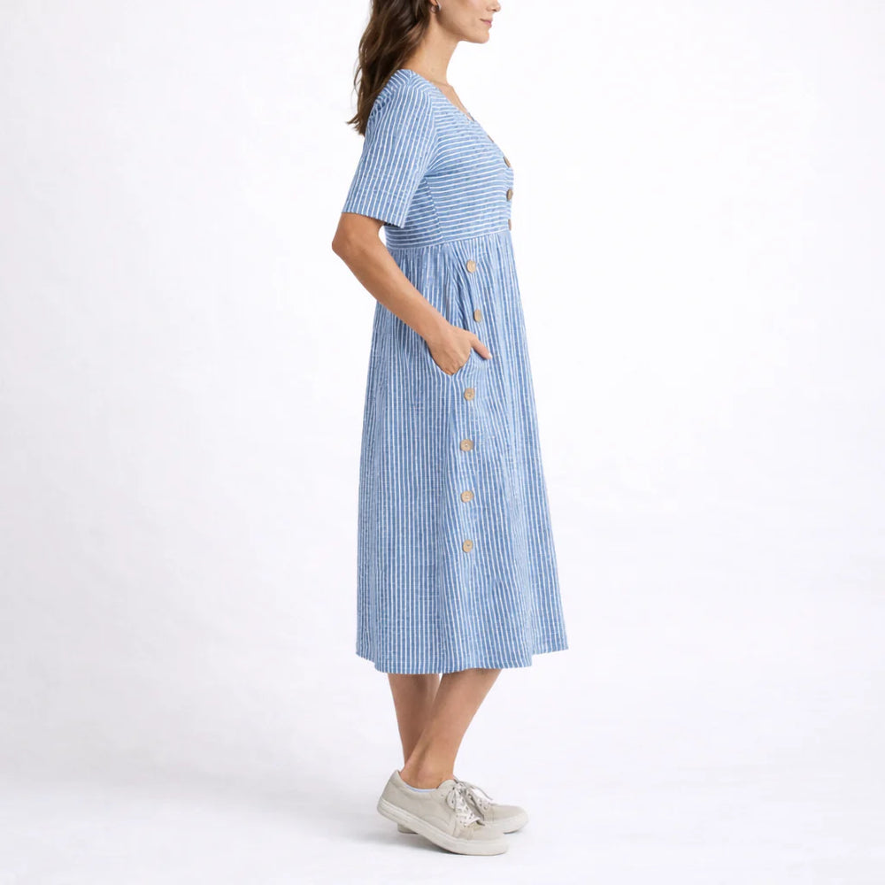 Close-up view of striped midi dress showing button trim and relaxed bodice construction