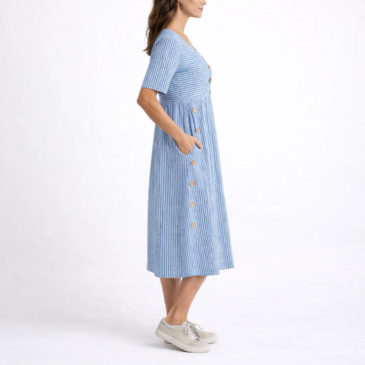 Close-up view of striped midi dress showing button trim and relaxed bodice construction