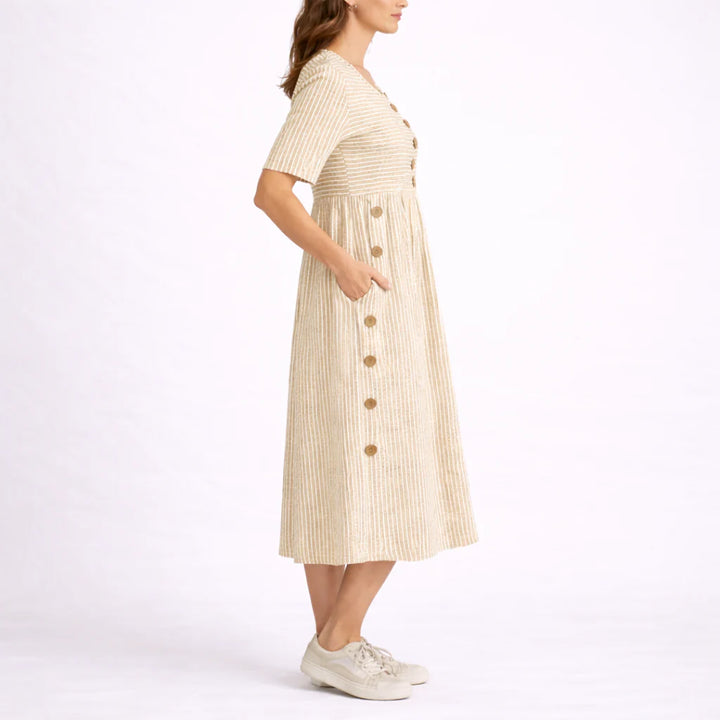 Detail shot of striped midi dress neckline and decorative button placement