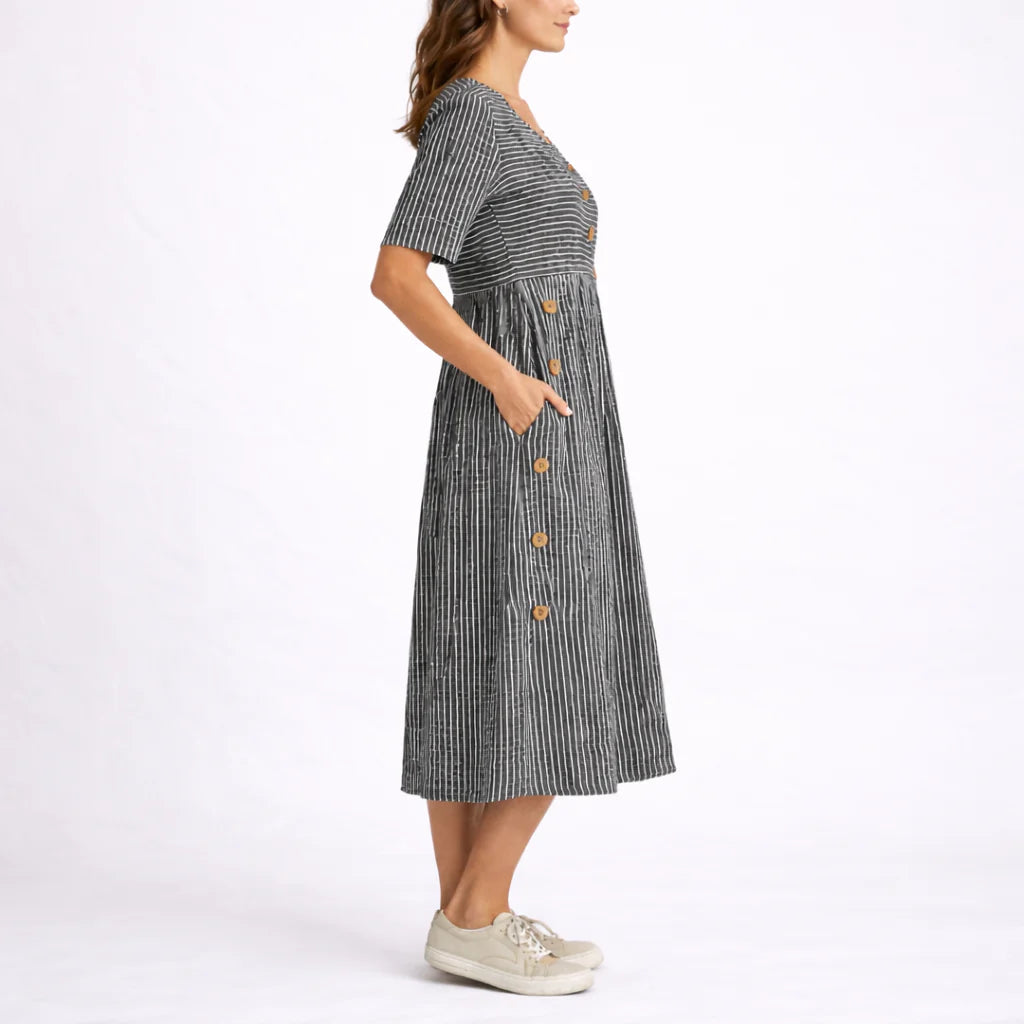 Back view of striped midi dress displaying scoop neckline and gathered skirt detail