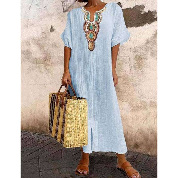 Side view of Summer Maxi Dress showing relaxed fit, short sleeves and ankle-length hem with split detail