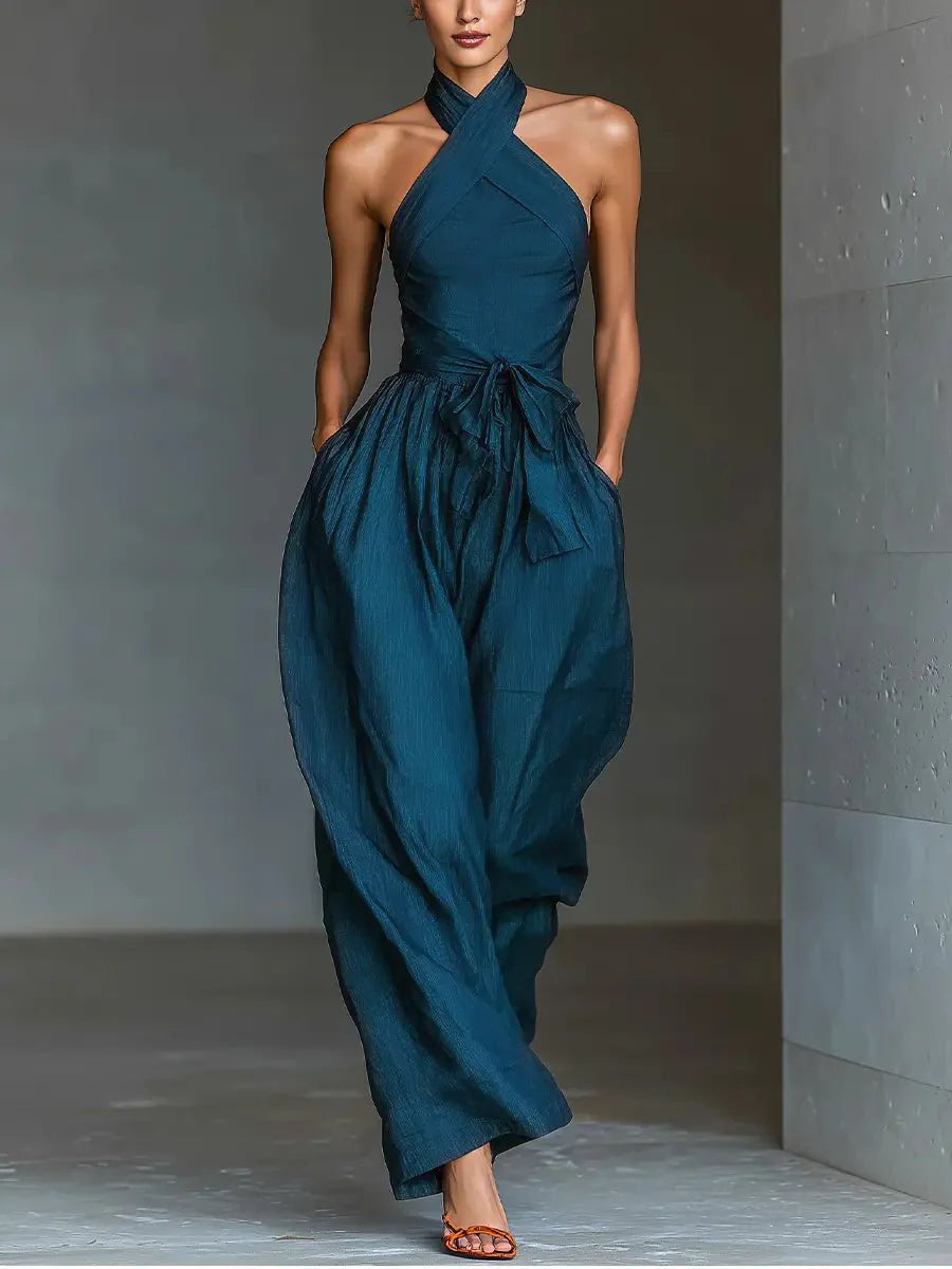 Women's Cross Halter Wide-Leg Linen Jumpsuit in deep teal with architectural halter neckline and flowing wide-leg trousers