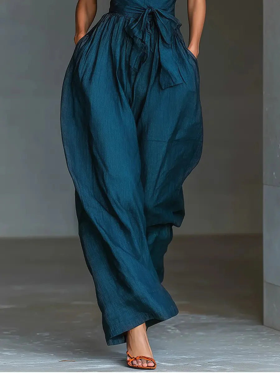 Detail shot of Women's Cross Halter Wide-Leg Linen Jumpsuit highlighting cross halter neckline construction and tie waist