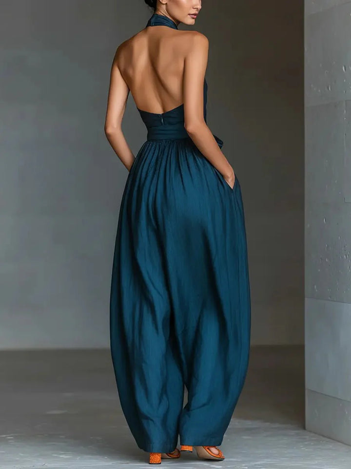 Full-length view of Women's Cross Halter Wide-Leg Linen Jumpsuit showing flowing wide-leg trousers and open back design