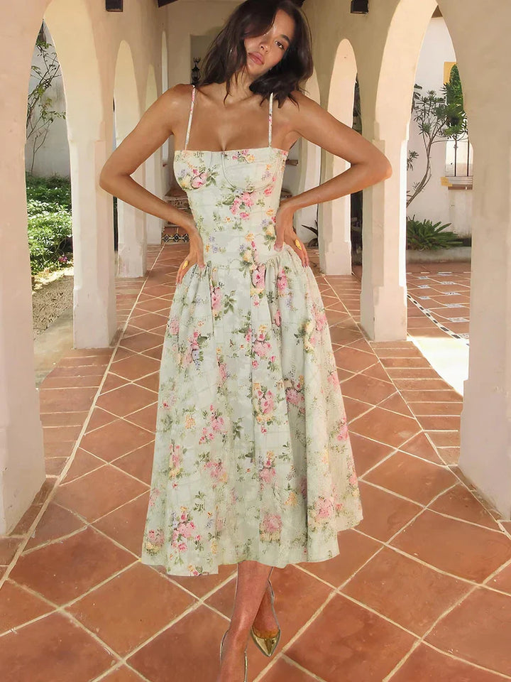Women's Floral Strap Midi Wedding Guest Dress in soft pastel floral print with structured bodice and flowing skirt