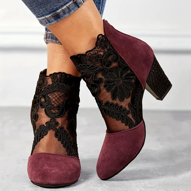 Close-up view of embroidered floral lace appliqué on sheer mesh ankle heels with embellished block heel