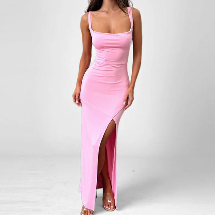 Full-length evening dress with dramatic leg slit and structured silhouette