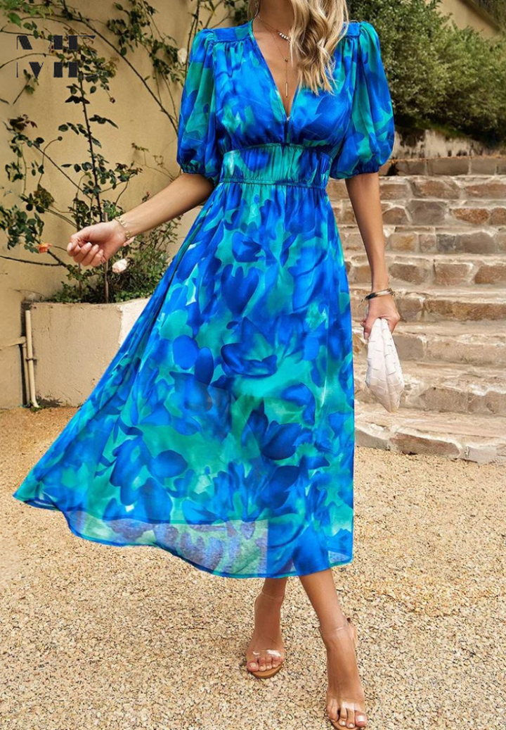 Women's Abstract Print Midi Dress shown in outdoor setting highlighting vibrant print and midi length