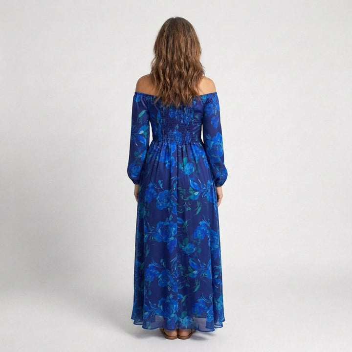 Full-length view of flowing maxi dress with off-the-shoulder neckline and long sleeves