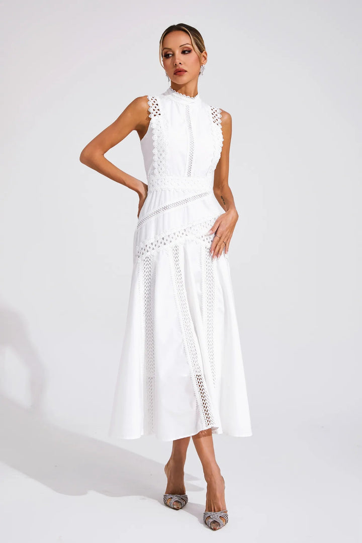 Front view of sleeveless lace midi wedding guest dress showing high neckline and structured bodice