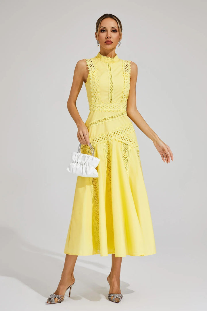 Full-length view of women's sleeveless lace midi wedding guest dress in yellow