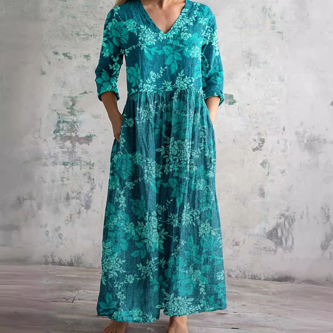 Full view of women's summer dress with V-neck and floral pattern in relaxed maxi silhouette