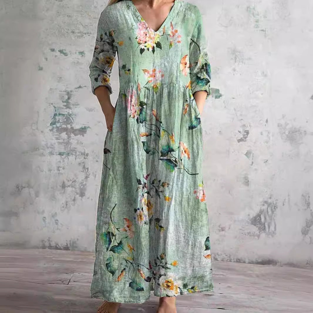 Side view of relaxed fit women's summer dress showing gathered waist and A-line maxi skirt with botanical print