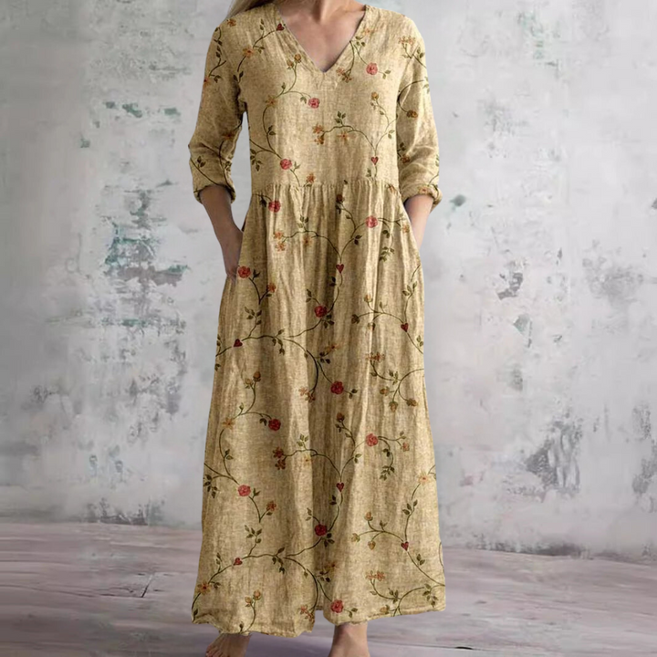 Detail of side pocket and floral print on women's summer dress with lightweight woven fabric