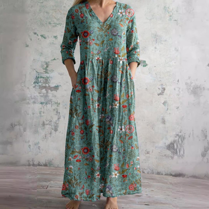 Women's summer dress styled with sandals, showing full-length maxi cut and floral pattern placement