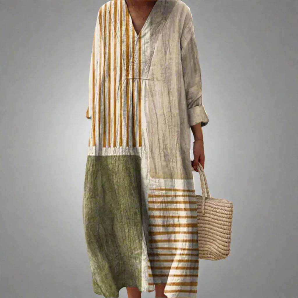 Linen summer dress in patchwork design with striped and block panels, V-neckline, and relaxed maxi length for warm weather wear