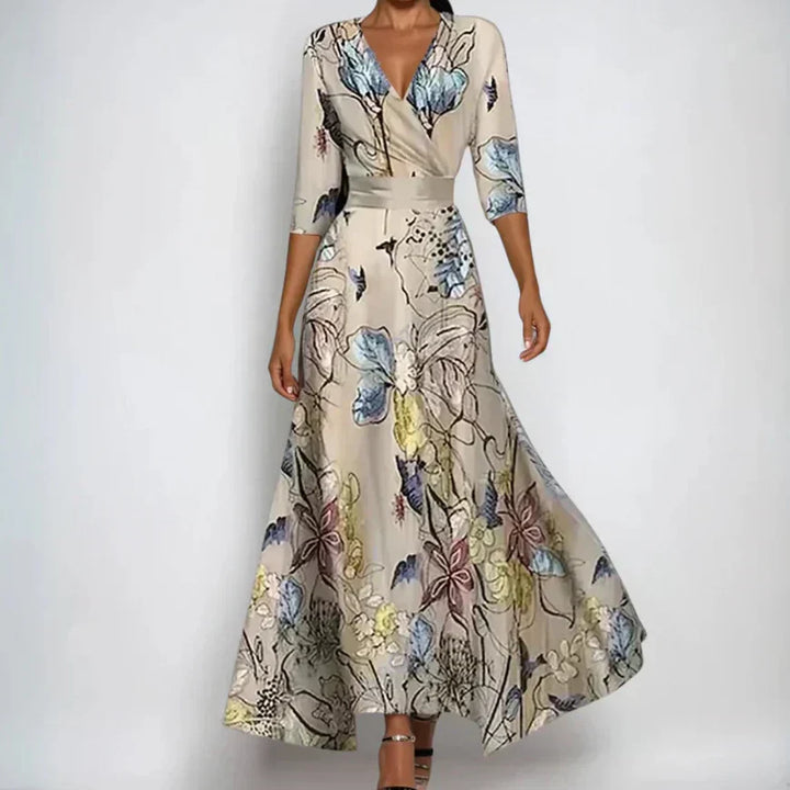 Floral wrap maxi dress with flattering design featuring botanical print and 3/4 sleeves on model