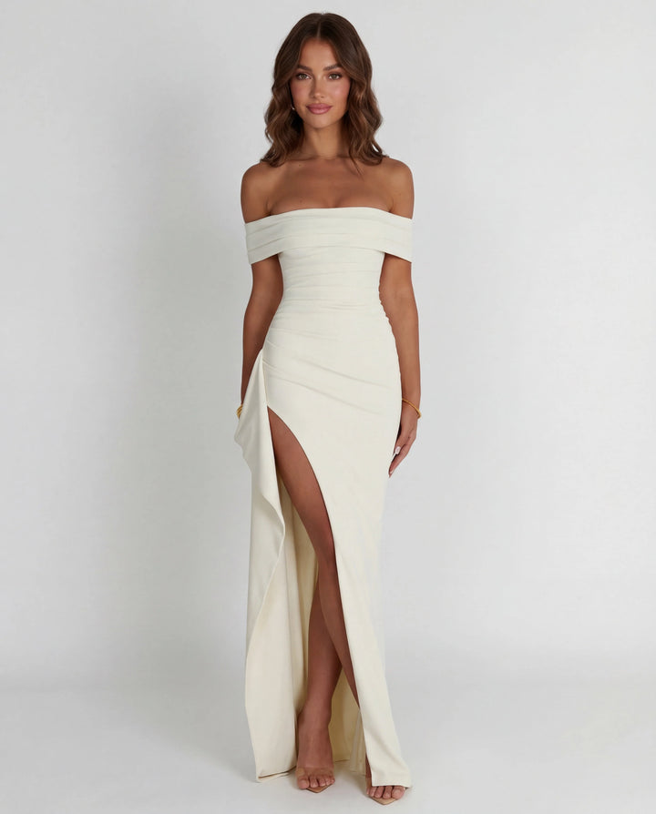 Light pink off-shoulder maxi dress with bodycon fit and cascading side panel