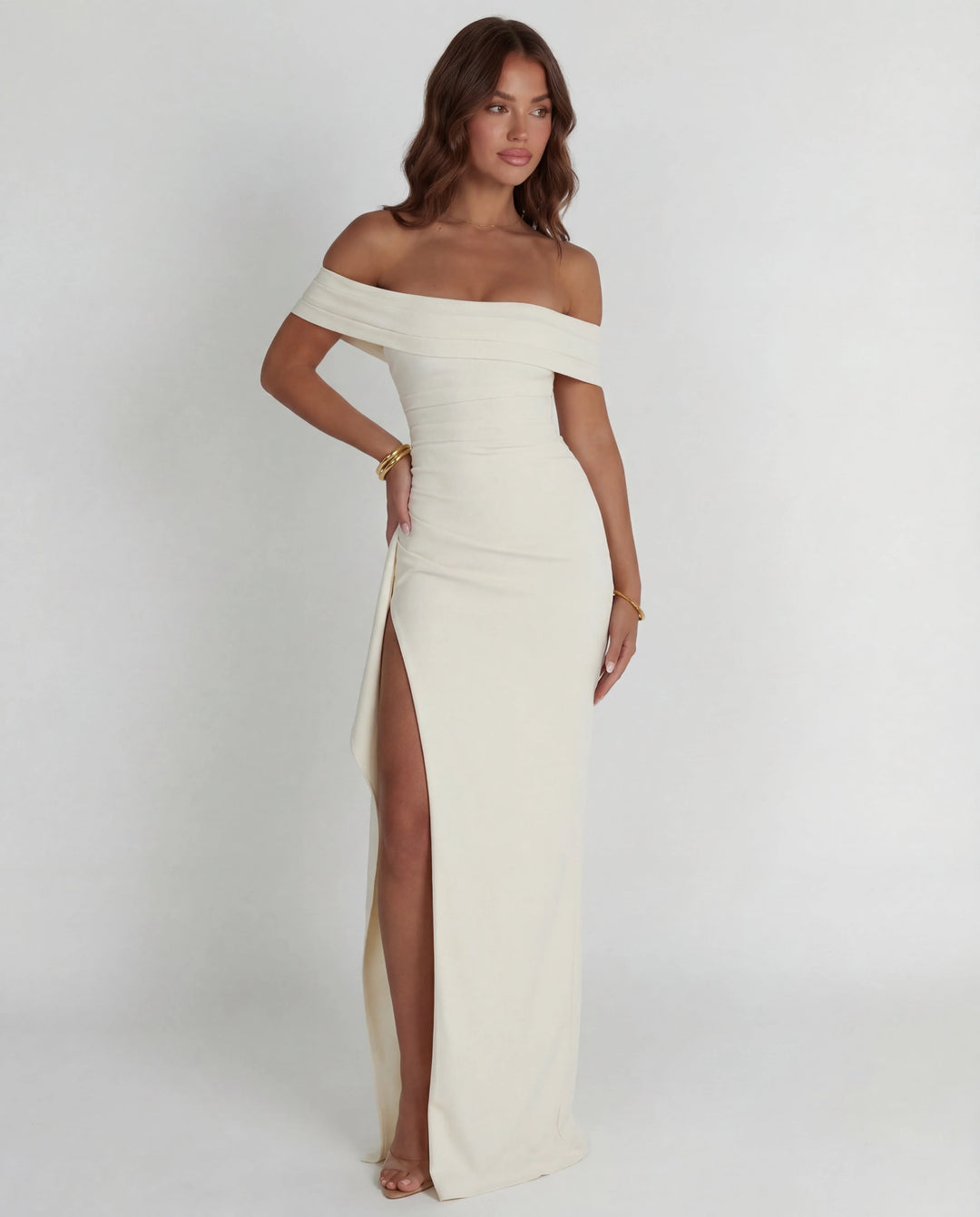 Bodycon maxi dress featuring off-shoulder design and thigh-high slit for evening wear