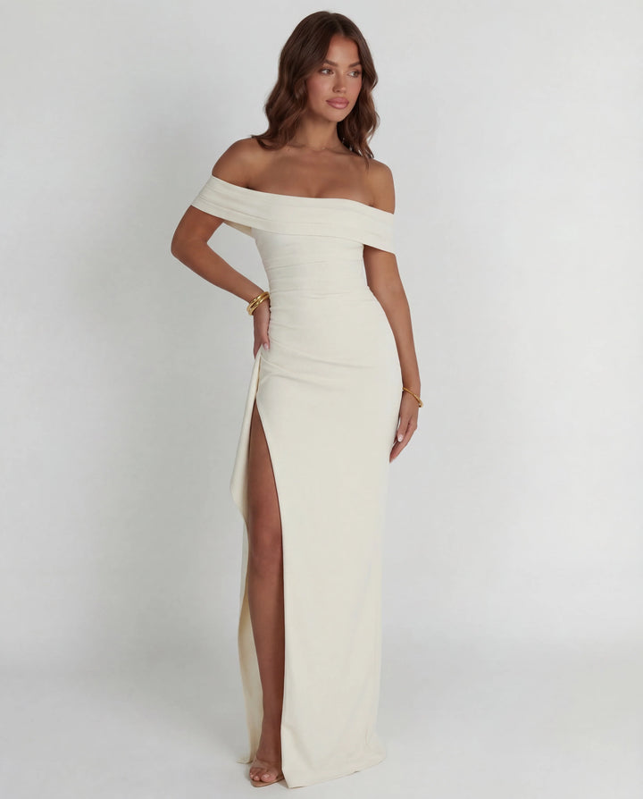 Bodycon maxi dress featuring off-shoulder design and thigh-high slit for evening wear