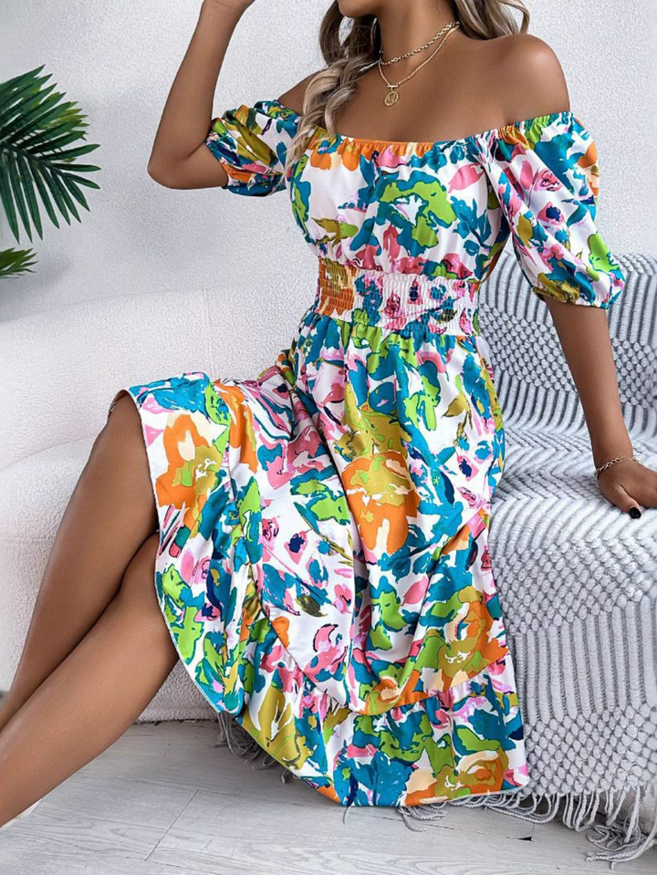 Full-length view of the Women's Boho Off Shoulder Midi Dress showing the flowing midi skirt and floral pattern