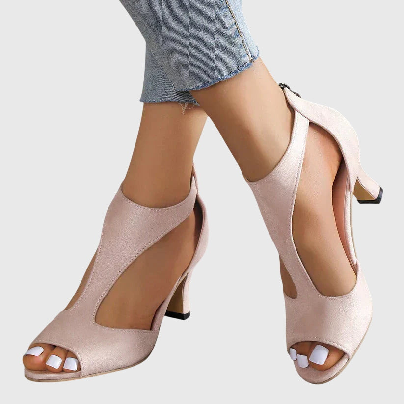 Maisie orthopedic peep toe heels in blush pink with block heel and ankle zip closure on model