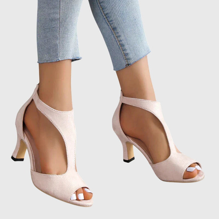 Close-up view of orthopedic peep toe heels showing open-toe design and structured upper with cushioned footbed