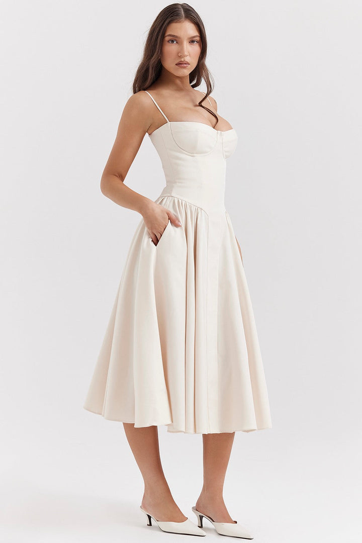 Close-up view of the fitted corset bodice with adjustable thin straps on midi dress