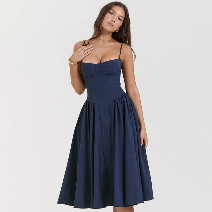 Detail of the adjustable straps and sweetheart neckline on corset midi dress