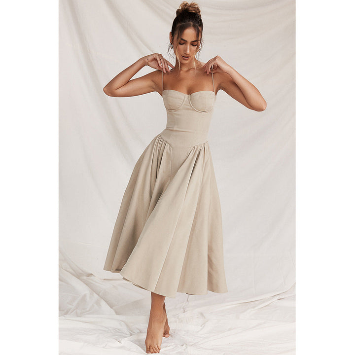 Model twirling in the flowing midi skirt of the corset dress