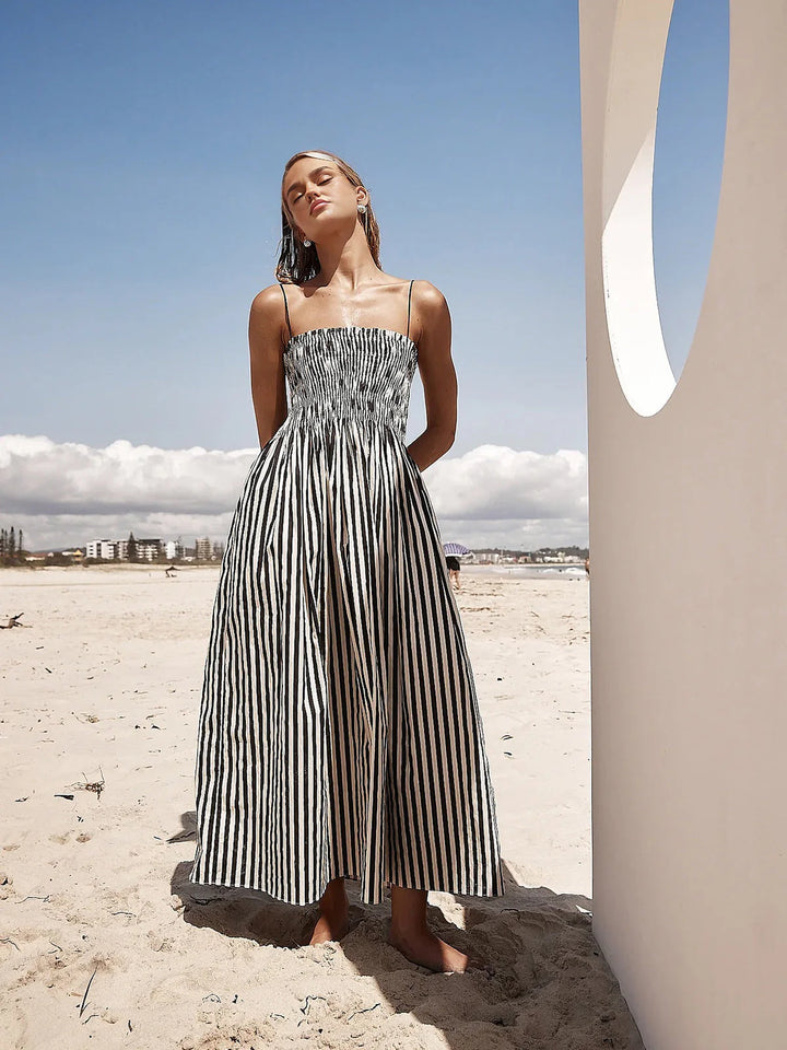 Detail shot of sleeveless pinstripe long dress adjustable spaghetti straps and elasticated bodice construction