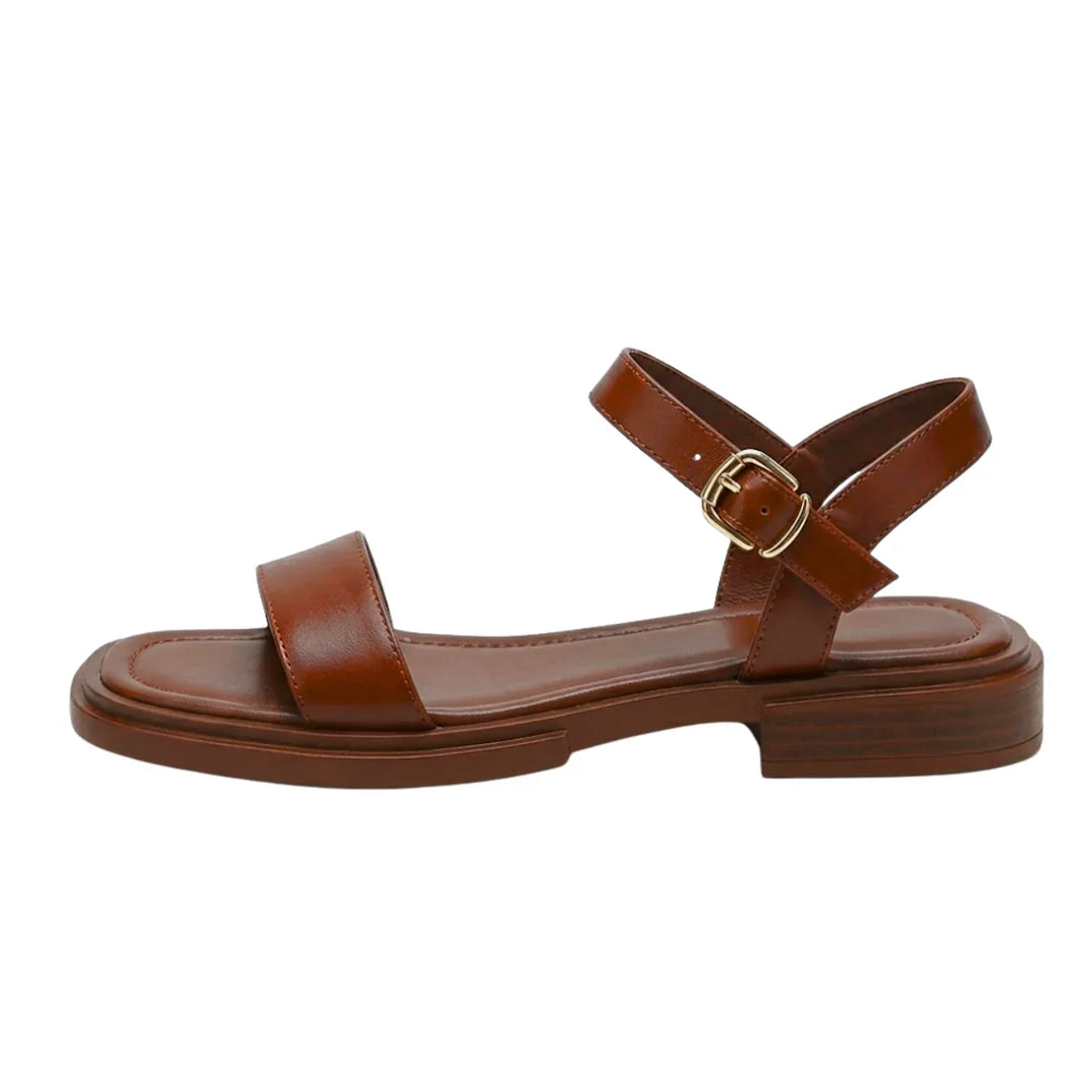 Women's ankle strap sandals styled with casual summer outfit and anklet