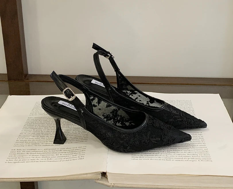 Close-up of lace slingback heel showing sheer beaded overlay and adjustable ankle strap