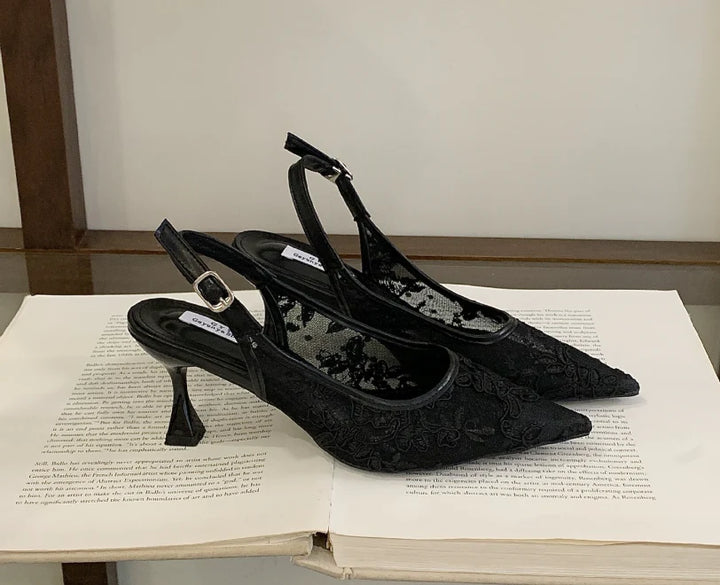 Close-up of lace slingback heel showing sheer beaded overlay and adjustable ankle strap