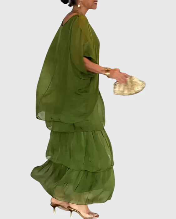 Full-length view of womens boho dress with oversized green top and vibrant tiered maxi skirt