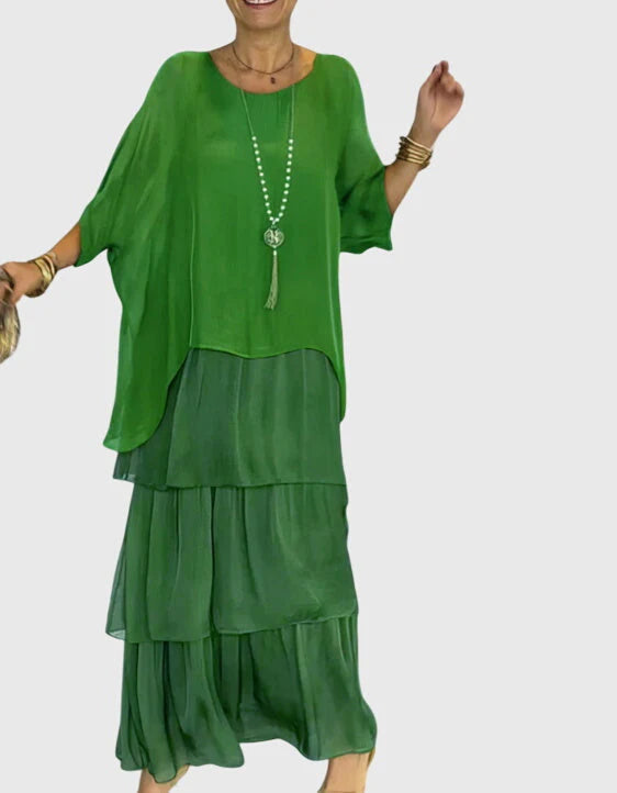 Back view of boho layered dress with flowing skirt tiers and oversized green top