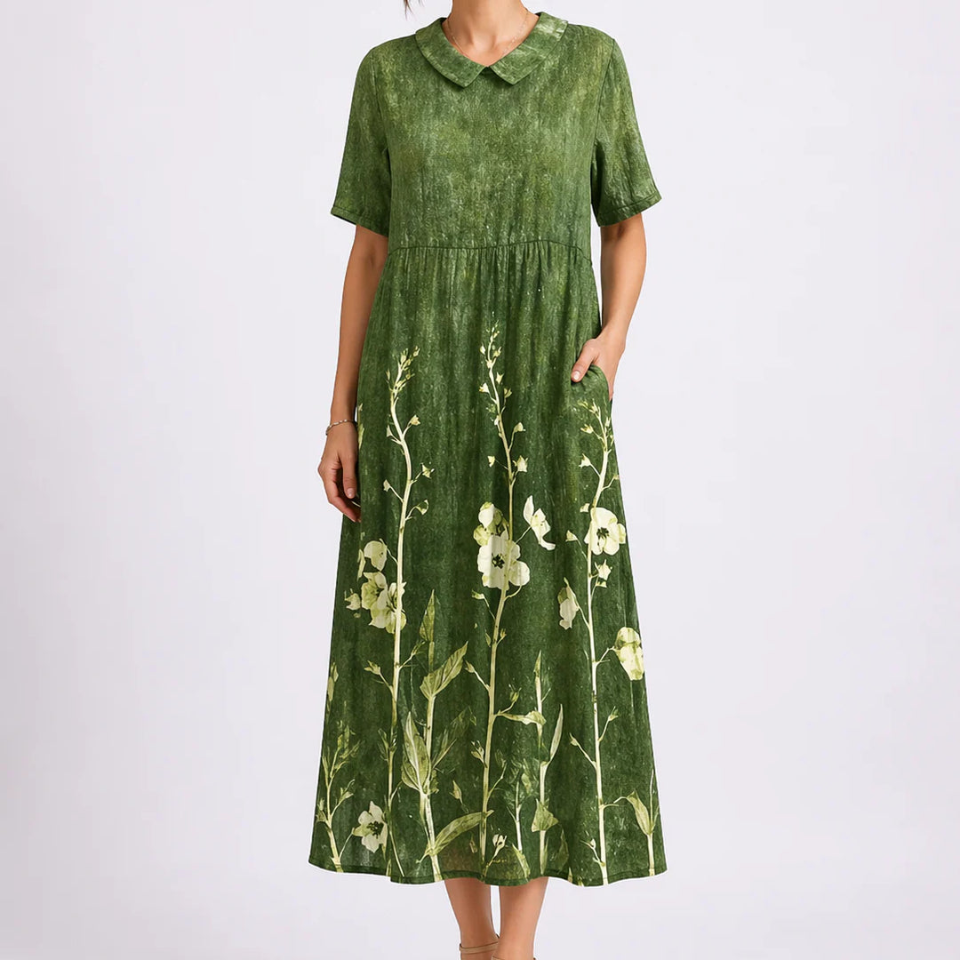 Side view of floral midi dress with relaxed fit and ankle-grazing length