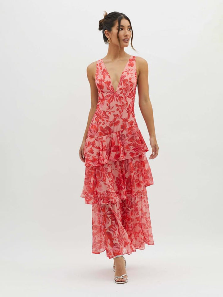 Tiered floral maxi dress with plunging V-neckline and layered pink floral print skirt for weddings