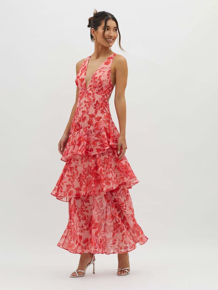 Full-length view of pink floral tiered maxi dress with V-neck and floaty layered skirt