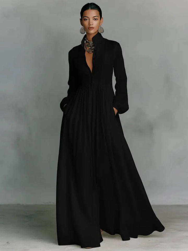 Close-up of stand-up collar and button-front closure on white maxi dress with smooth finish