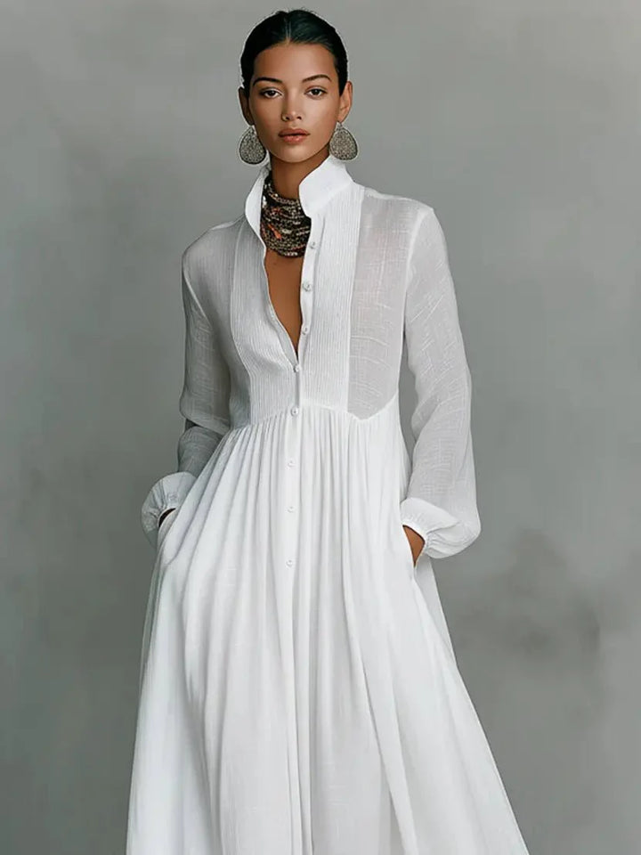 Full-length view of relaxed fit maxi dress with long sleeves and flowing skirt