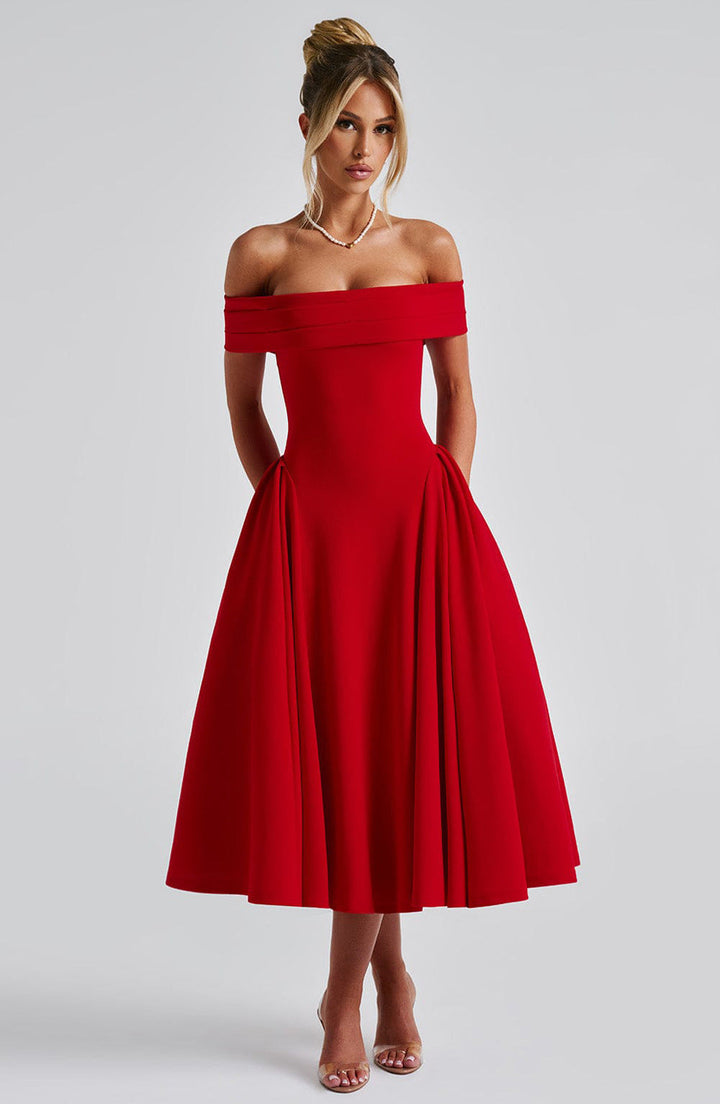 Olivia wearing the Off-Shoulder Flare Midi Dress in red with folded neckline and flared skirt