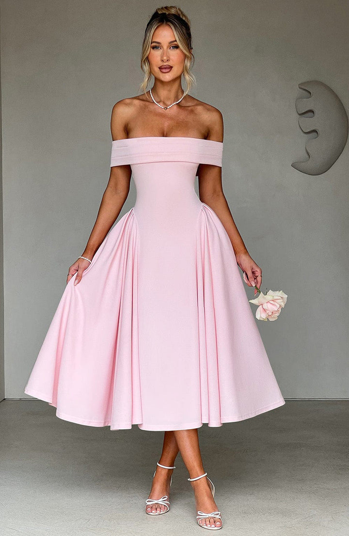 Full-length view of the Off-Shoulder Flare Midi Dress styled with heeled sandals for formal occasions
