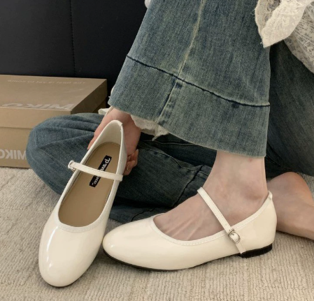 Close-up of women's patent Mary Jane shoes featuring cushioned insole and structured design for all-day comfort