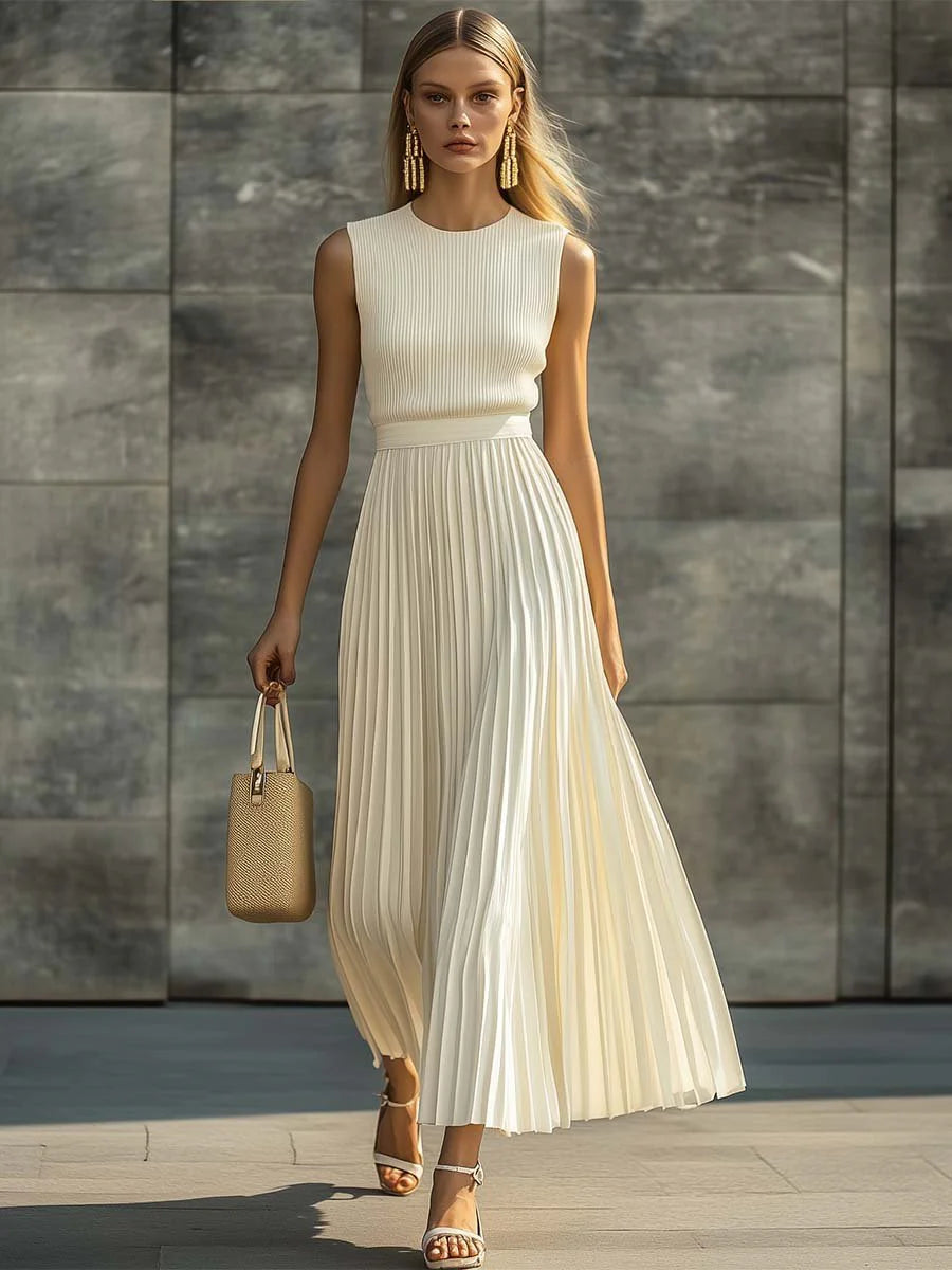 Side view of sleeveless knit pleated chiffon maxi dress showing full-length pleated hem and fitted bodice